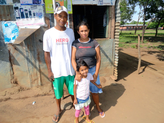 Ernesto & his family in front of their house.